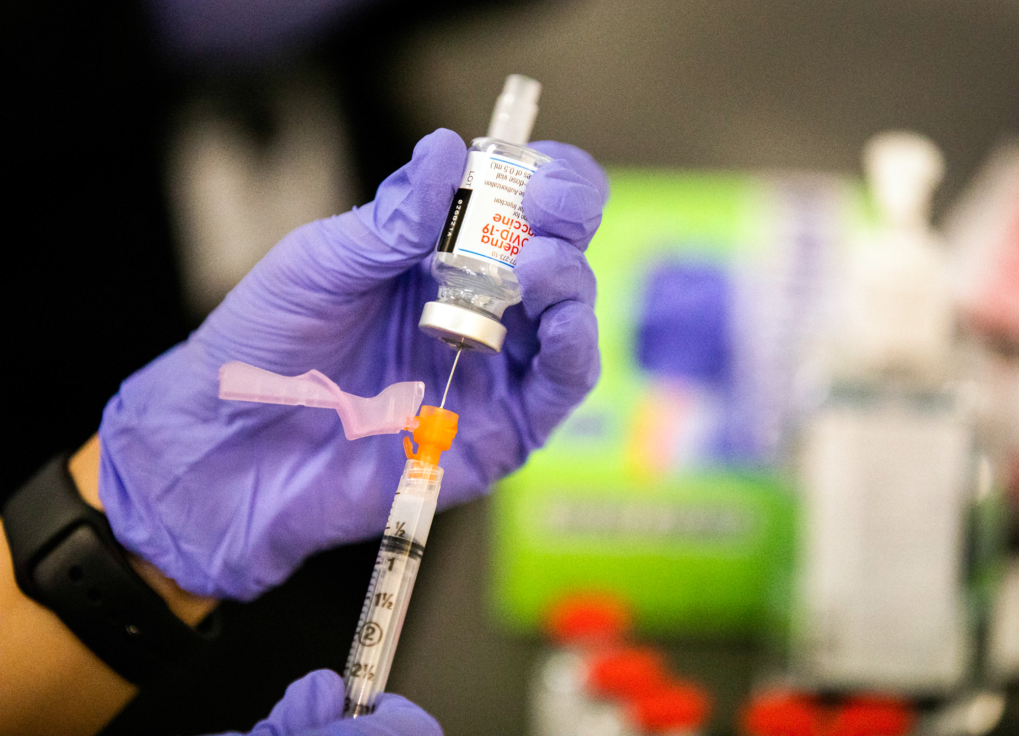 A medical staff member prepares a COVID -19 vaccine during the Amazon employees Covid-19 vaccination event at the Amazon Fulfillment Center in North Las Vegas.